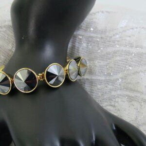 Henri Bendel Smoky Gunmetal Swarovski Round Crystal Logo Snap Bracelet 7"